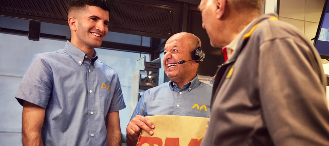 McDonald's employees smiling in a restaurant