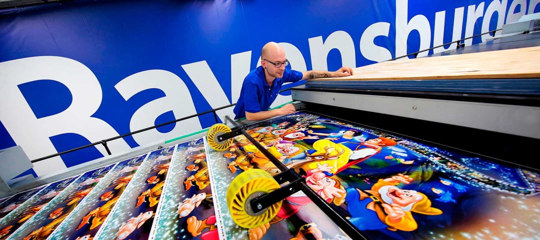 An employee using a large machine